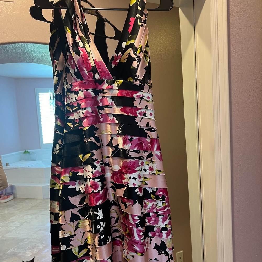 This is a vintage dress. No tags. Fitted halter with open back.